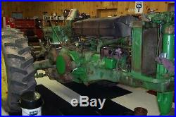1957 John Deere Model 720 Gas Check the photos for the amount of work