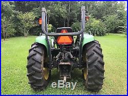 2000 John Deere model 4600 tractor with front loader and 6' Woods Brush cutter