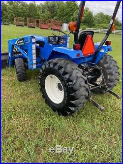 2006 New Holland TC30 4x4 hydrostatic loader tractor and new attachments