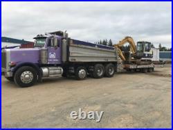 96 Peterbilt 302 dump truck with drop axle. Purple in color. Good condition