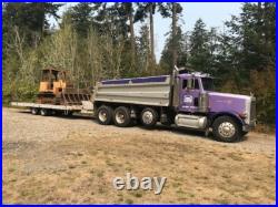 96 Peterbilt 302 dump truck with drop axle. Purple in color. Good condition