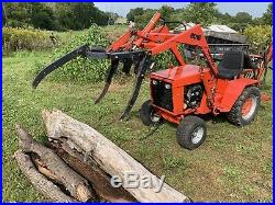 Ingersoll 6018 Loader backhoe compact tractor with skidder grapple attachment