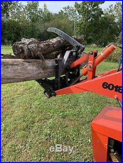 Ingersoll 6018 Loader backhoe compact tractor with skidder grapple attachment