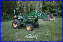 John Deere 750 4wd tractor with 60 inch three point blade, rear finish mower