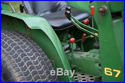 John Deere 750 4wd tractor with 60 inch three point blade, rear finish mower