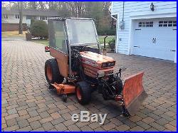 Kubota B7200 17 HP 4 Wheel Drive Tractor With 60' Front Snow Blade, Mower, and Cab