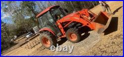 Kubota LA514 Orange Industrial Loader Tractor with Front Loader Attachment