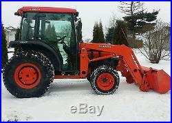 Kubota tractor 4x4 with cab, loader, and low hours