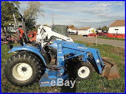 NEW HOLLAND TRACTOR WITH LOADER