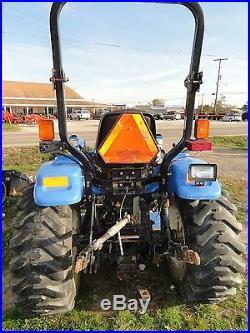NEW HOLLAND TRACTOR WITH LOADER