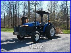 New Holland TN70 tractor with Alamo flail mower and Woods three point mower 69hp