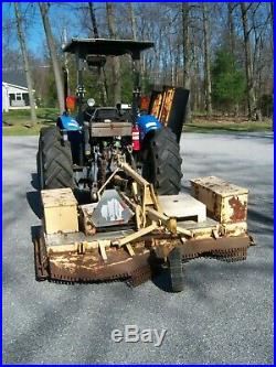 New Holland TN70 tractor with Alamo flail mower and Woods three point mower 69hp