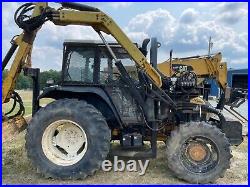 New Holland Tractor, Side Boom Mower, 4x4 side boom brush hog tractor. Air cond