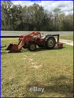 Tractor with loader and trailer